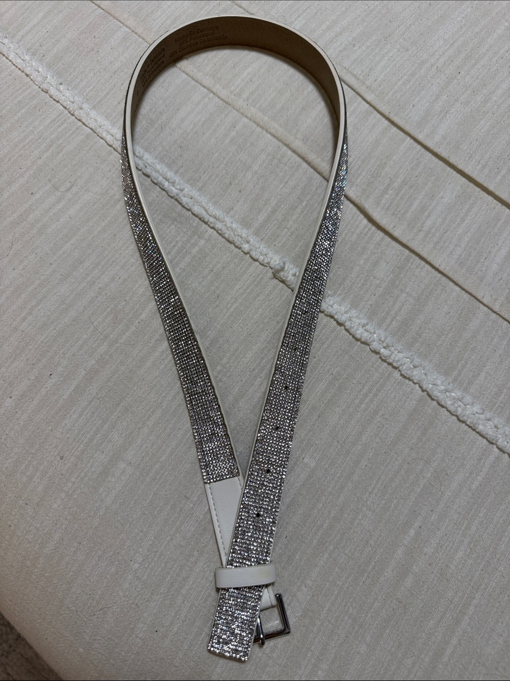 White Strap Belt with rhinestone accent. 32” size small - never used